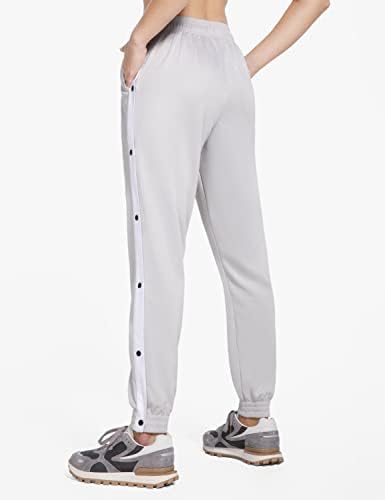 מכנסי טרנינג מחודדים של מכנסי טרנינג מחודדים עם מכנסיים מחממים לכיסים עם כיסים עם כיסים.